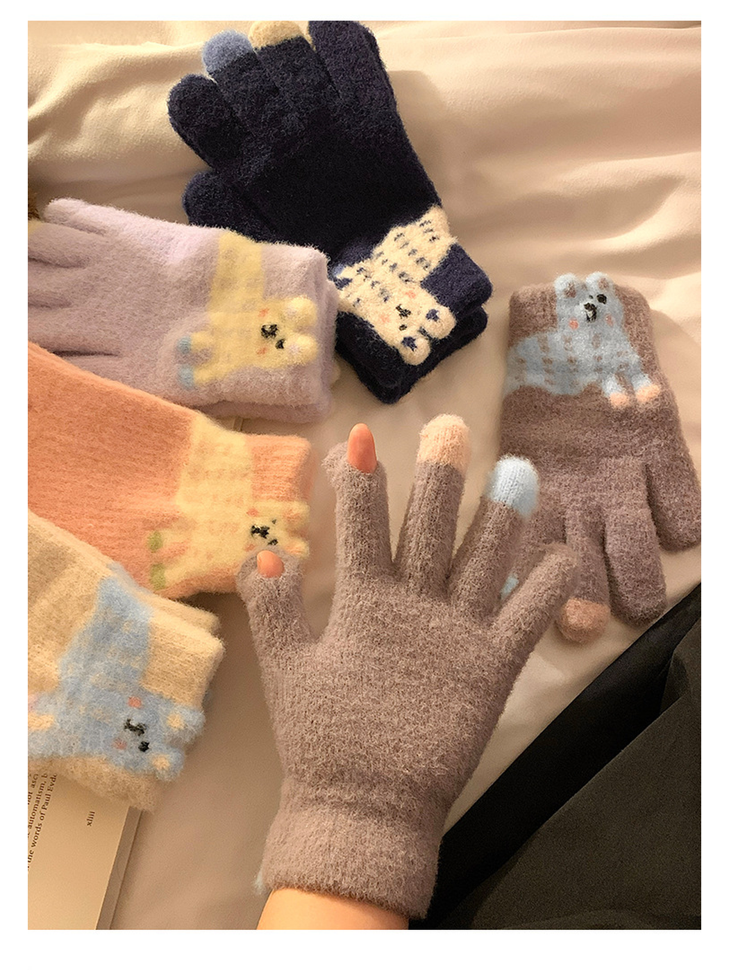 Five glove colors arranged together with one Greige glove worn