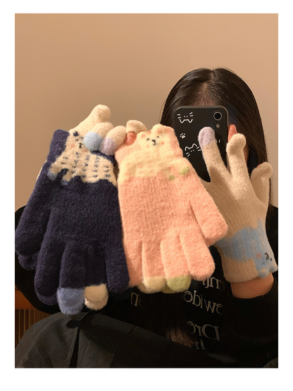 Navy, Pink and Beige fuzzy gloves displayed in a mirror scene