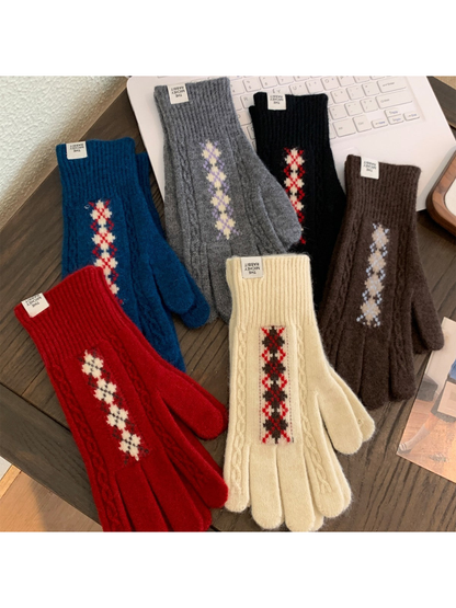 Red, ivory, teal blue, black, brown and gray patterned gloves displayed together