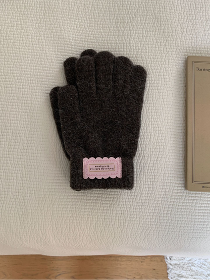 Dark Gray fuzzy knit gloves with ribbed cuffs and pink labels