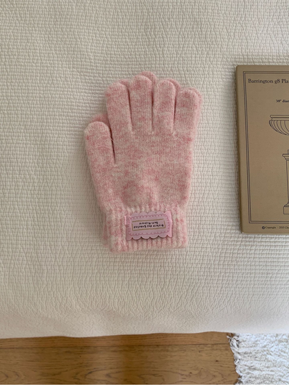 Light Pink fuzzy knit gloves with ribbed cuffs and pink labels