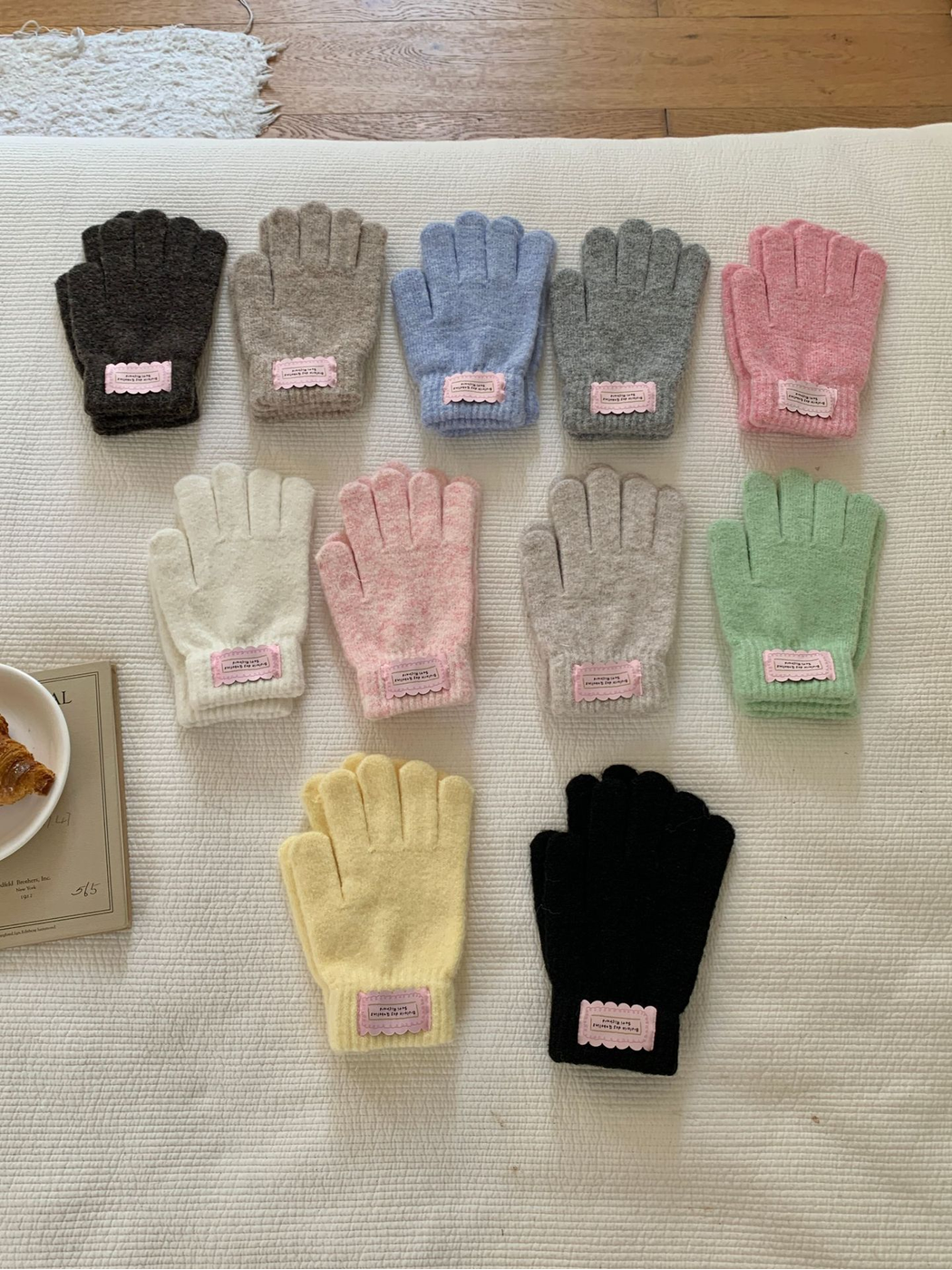 Multiple colors of fuzzy knit gloves arranged together