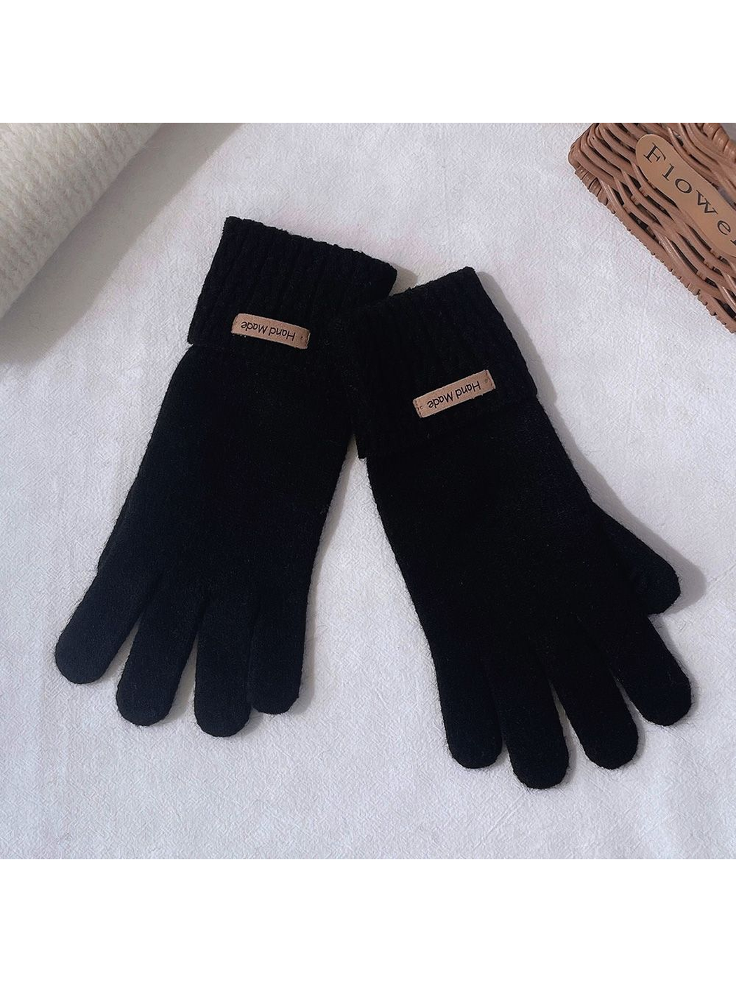 Black five-finger gloves with extended ribbed cuffs