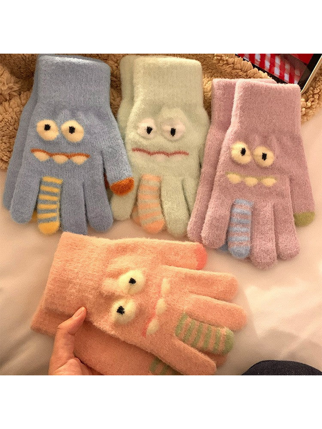 Cartoon monster gloves displayed in multiple colors