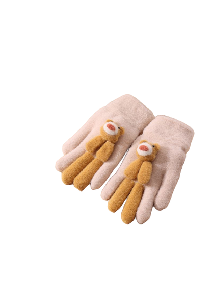 Beige fuzzy gloves with mustard teddy bear appliques, tabletop view