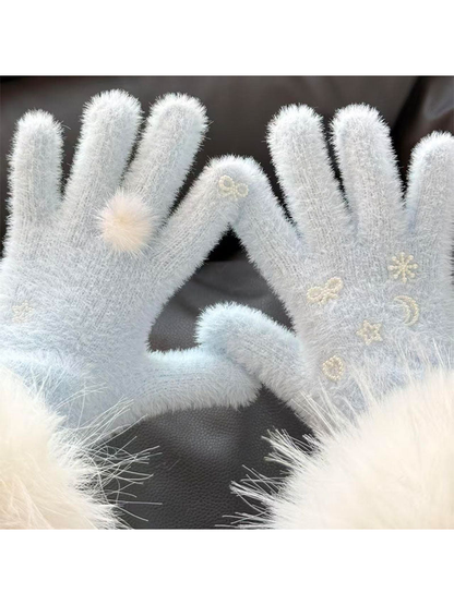 Close-up of Light Blue fuzzy gloves with a fluffy pom-pom and pearl-like motifs