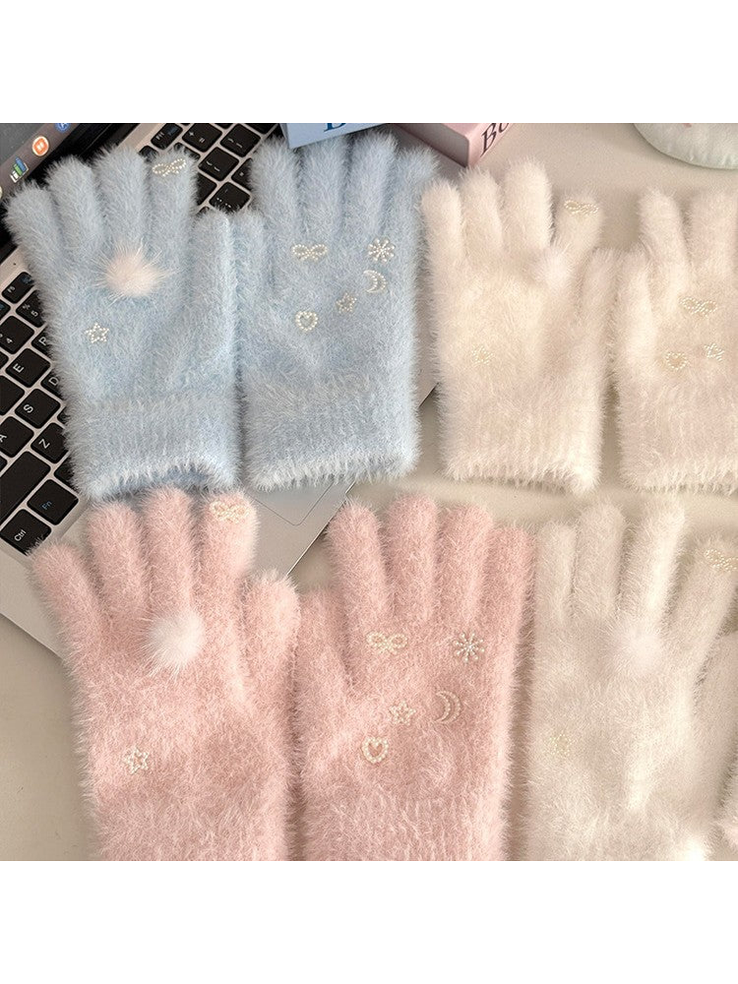Light Blue, White and Light Pink fuzzy gloves displayed together