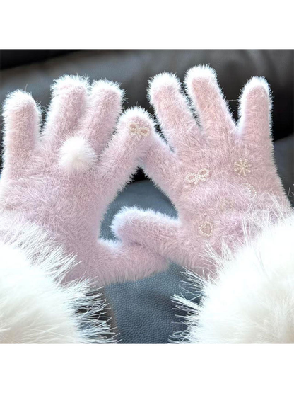 Close-up of Light Purple fuzzy gloves with a fluffy pom-pom and pearl-like motifs