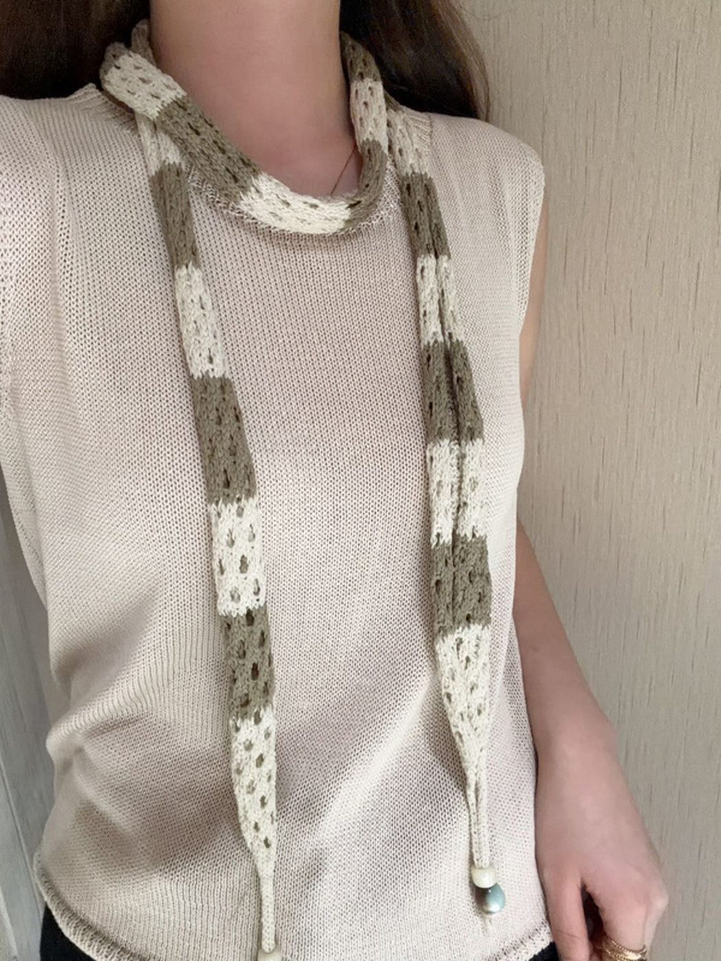 Beige Brown scarf draped loosely around the neck
