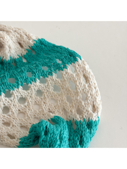 Close-up of the raised openwork texture and alternating color blocks