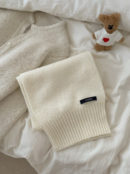 Ivory textured scarf with wide ribbed ends, folded display