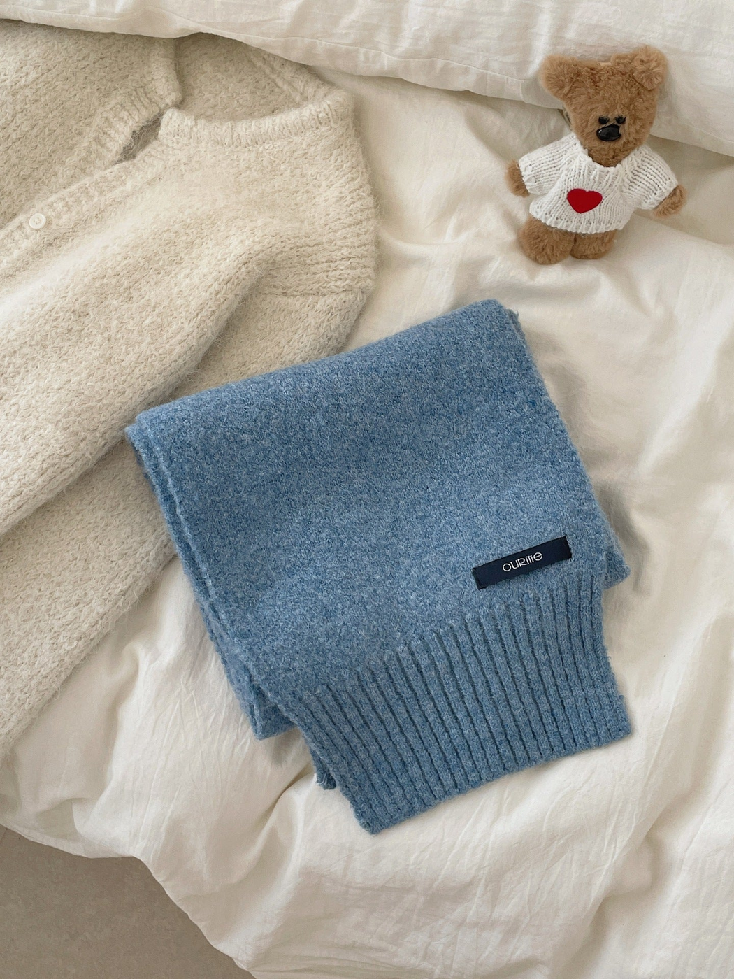 Light Blue textured scarf with wide ribbed ends, folded display