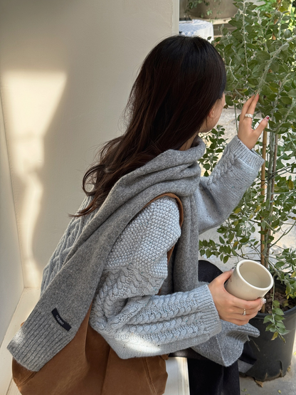 Heather Gray textured scarf draped over the shoulders, back view