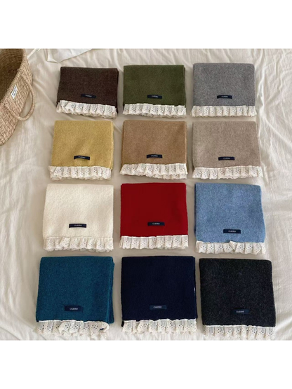 Lace-trim scarves displayed together in twelve colors