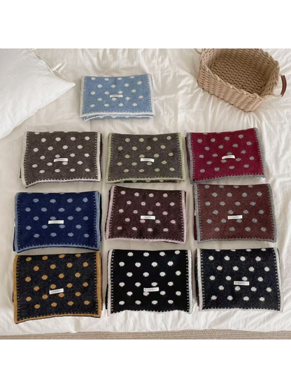 Polka-dot scarves in multiple color combinations displayed together