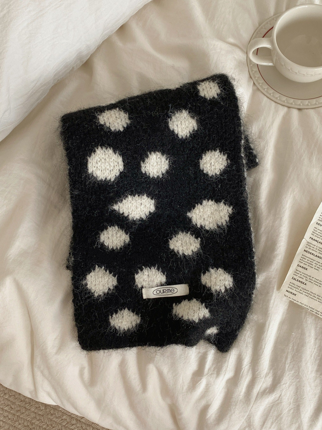 Black Ivory irregular polka dot scarf, folded view