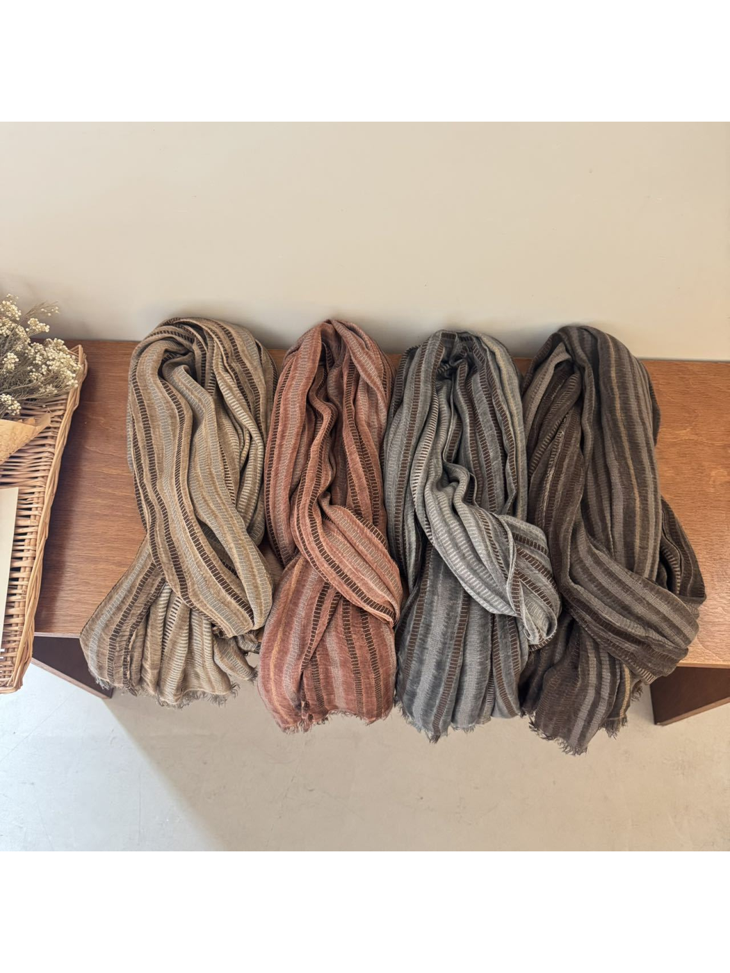 Four striped scarf colors arranged side by side