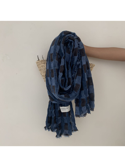 Blue scarf with rectangular block pattern and frayed edges