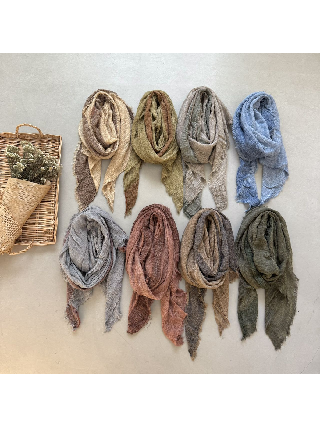 Eight two-tone scarves in assorted colors arranged together