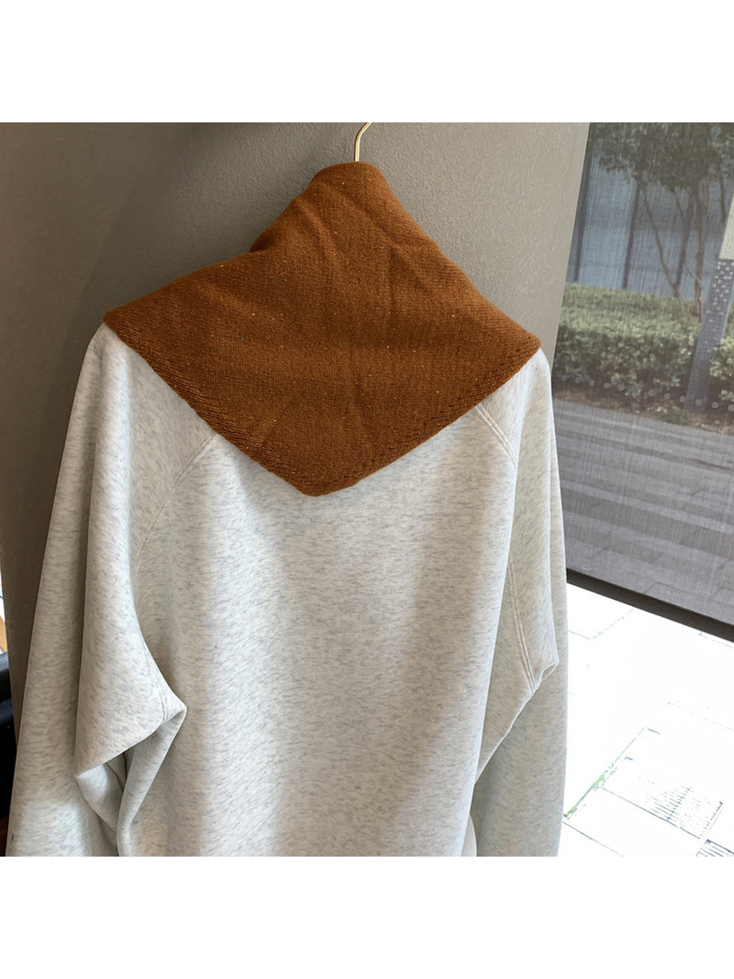 Back view of the caramel triangle scarf showing its pointed shape