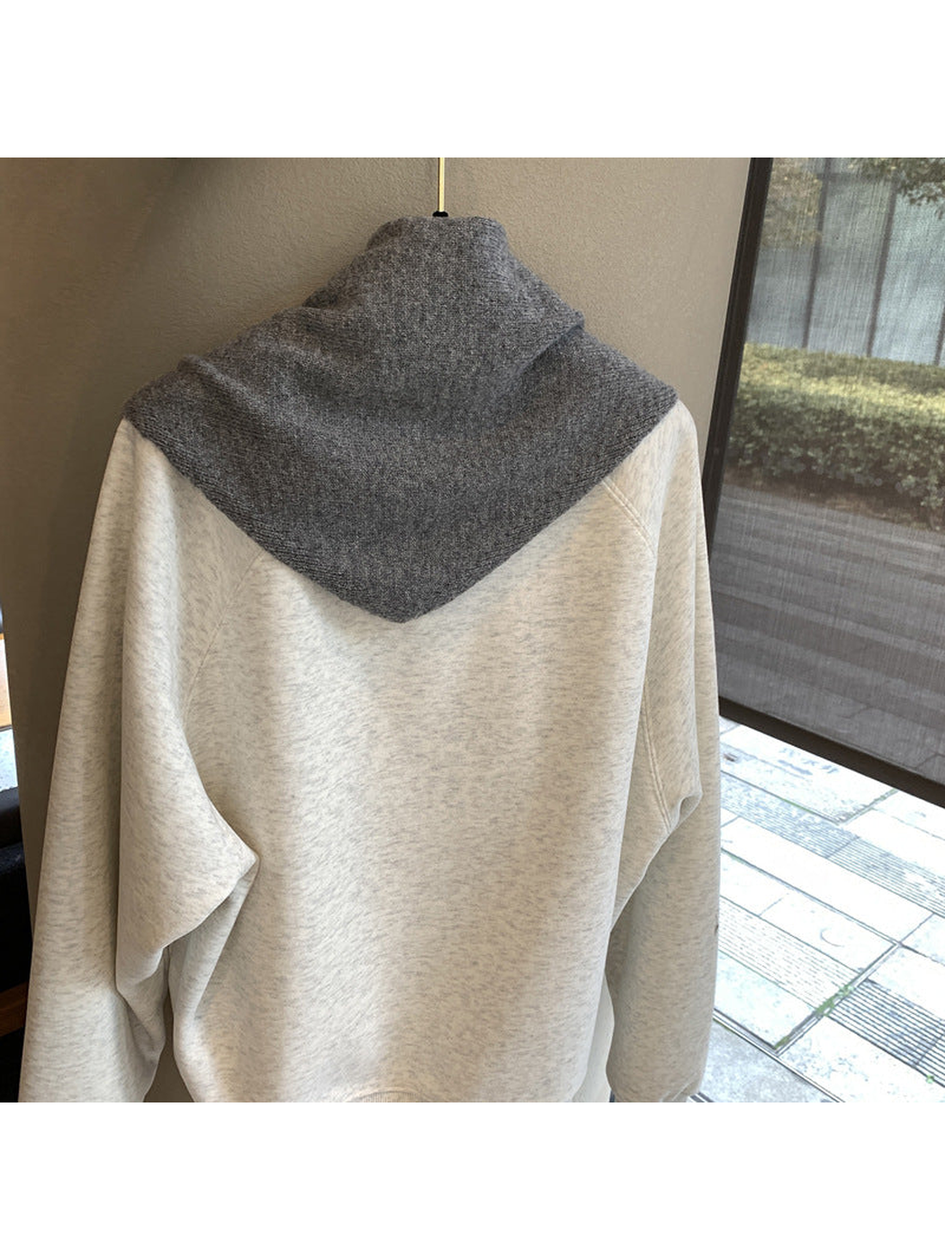 Back view of the dark gray scarf's triangular body