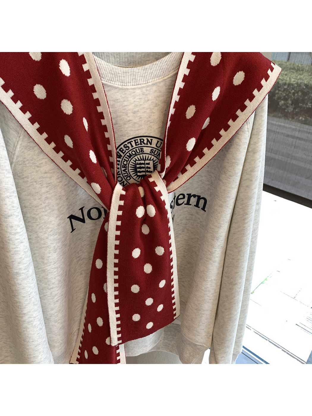 Close-up of the Red polka-dot scarf knot and hanging ends