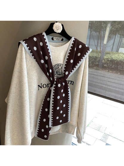 Dark Brown polka-dot scarf with contrast border in a tied front drape