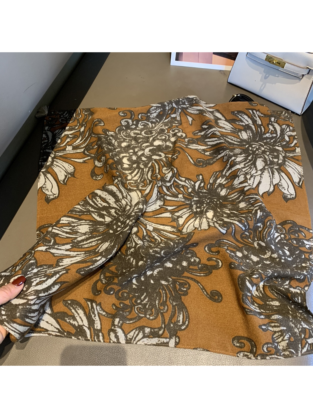Warm brown square scarf with large floral print and finished edges