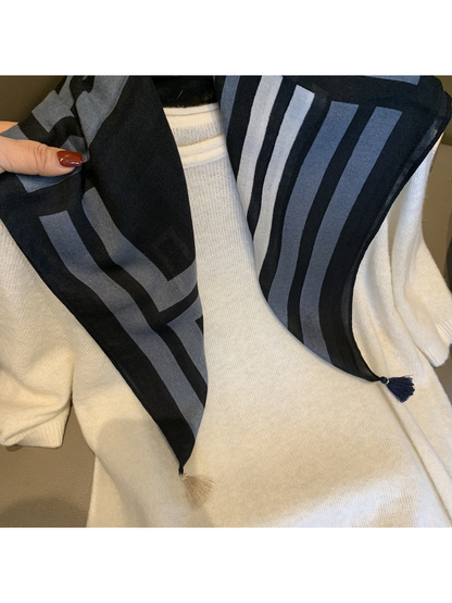 Close-up of the Black Gray scarf's geometric pattern and corner tassels