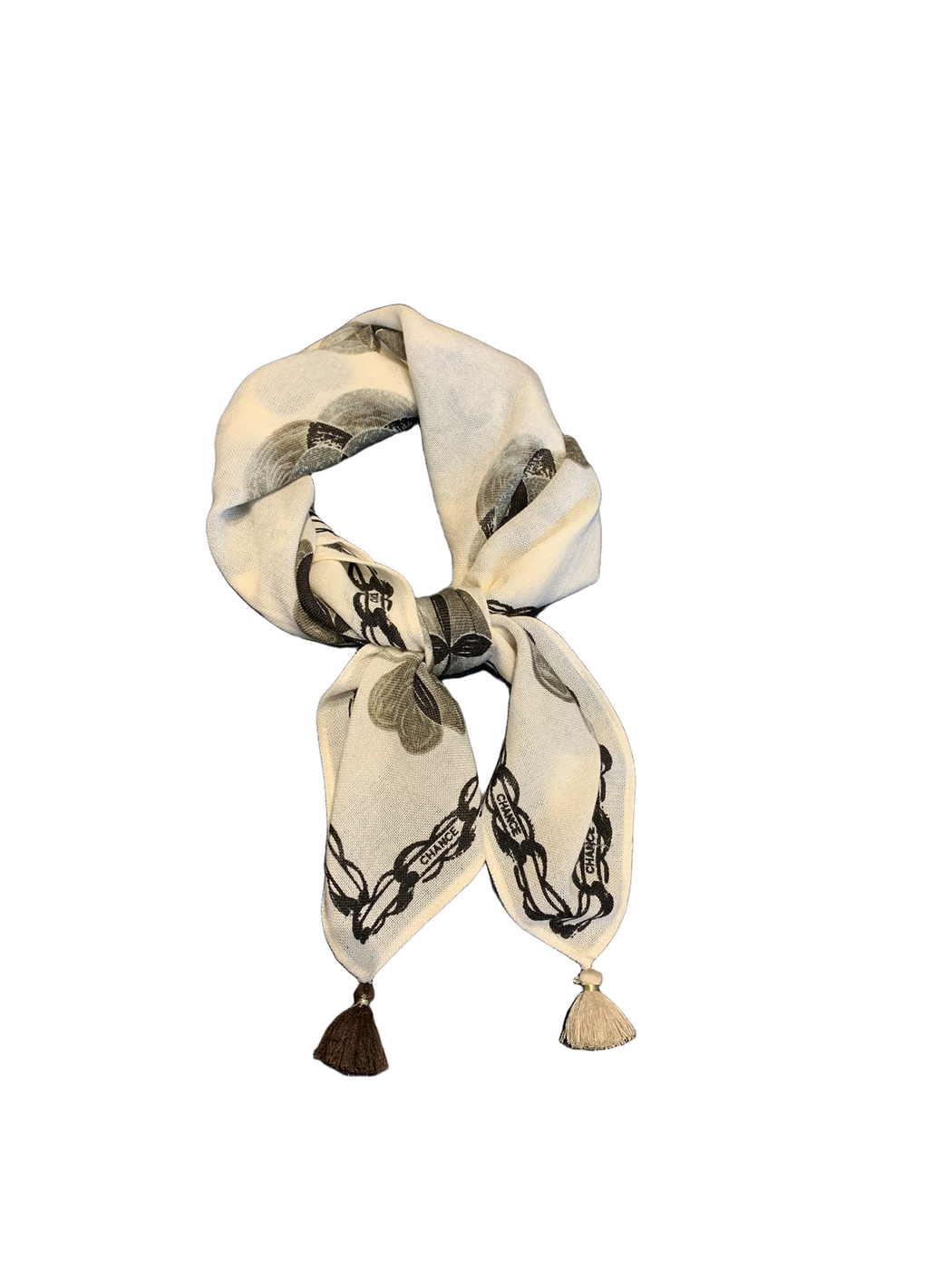 Ivory floral square scarf tied in a bow with contrasting tassel ends