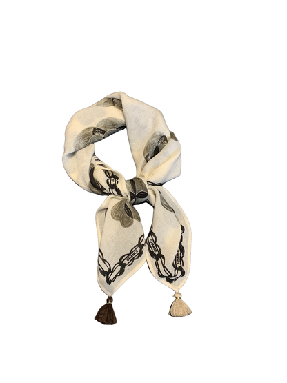 Ivory floral square scarf tied in a bow with contrasting tassel ends