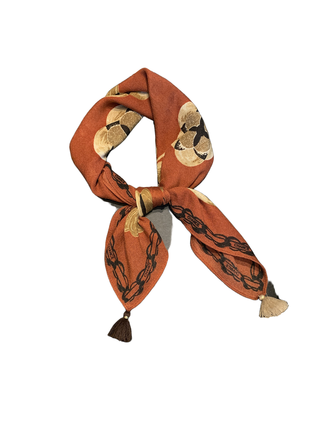 Orange Red floral square scarf tied in a bow with contrasting tassel ends