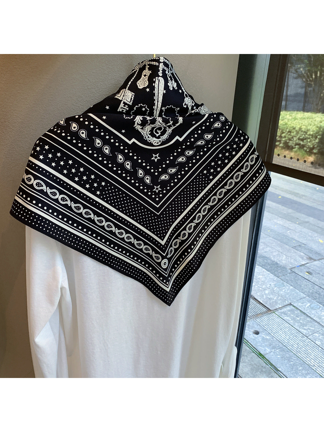 Back view of the Black Beige scarf showing its bordered paisley and star pattern