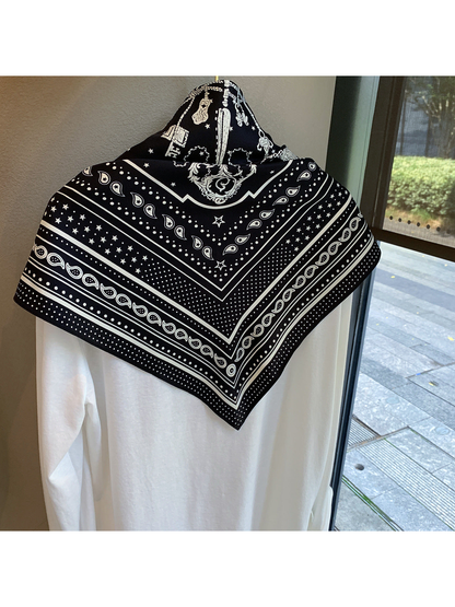 Back view of the Black Beige scarf showing its bordered paisley and star pattern