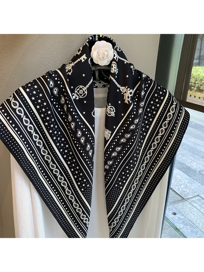 Close-up of the Black White scarf with paisley, stars, dots and striped borders
