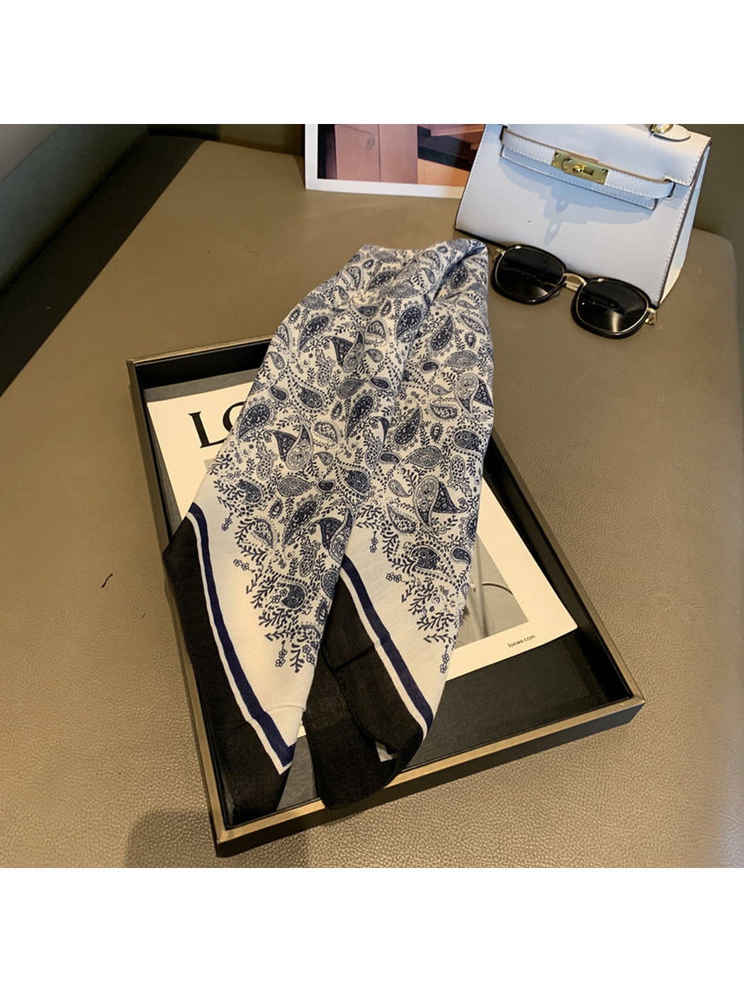 Navy and cream paisley square scarf draped lengthwise