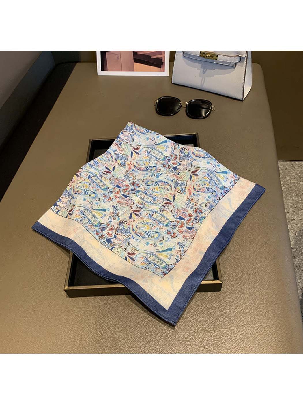 Folded multicolor paisley square scarf with ivory band and navy border