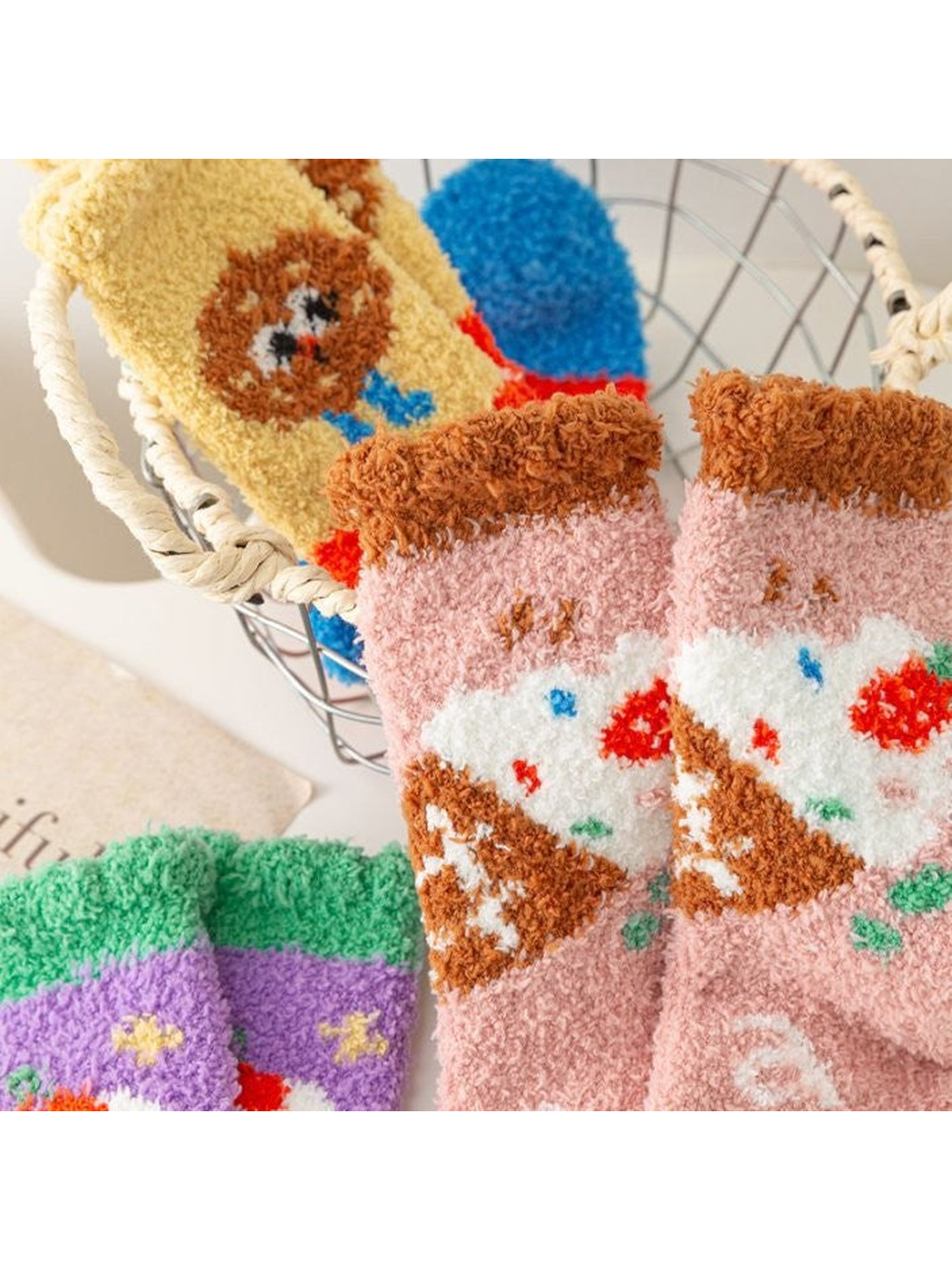 Close-up of fuzzy pink Ice Cream socks with contrasting cuffs and motifs