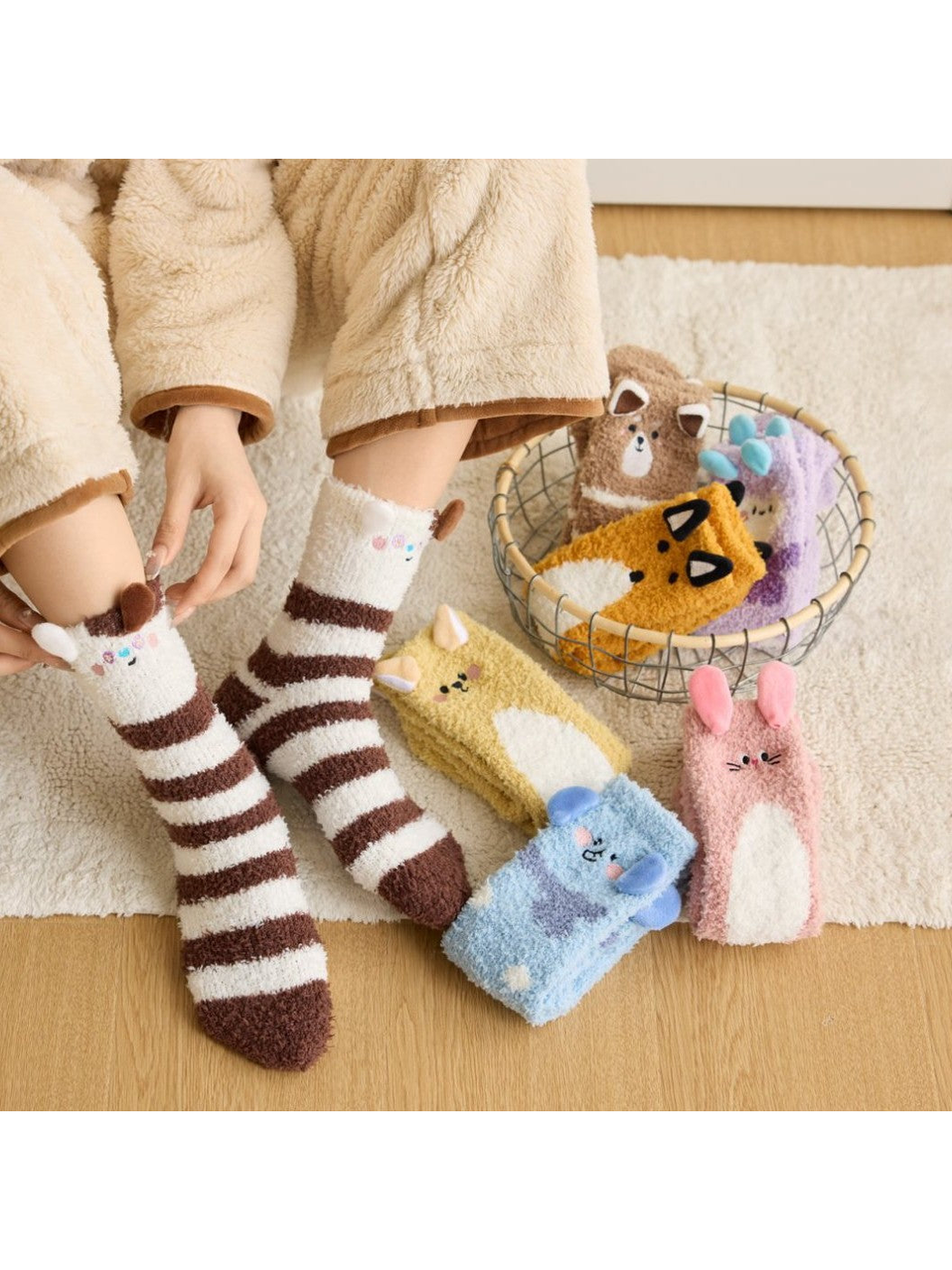Brown striped animal character socks worn beside multiple colorful animal designs