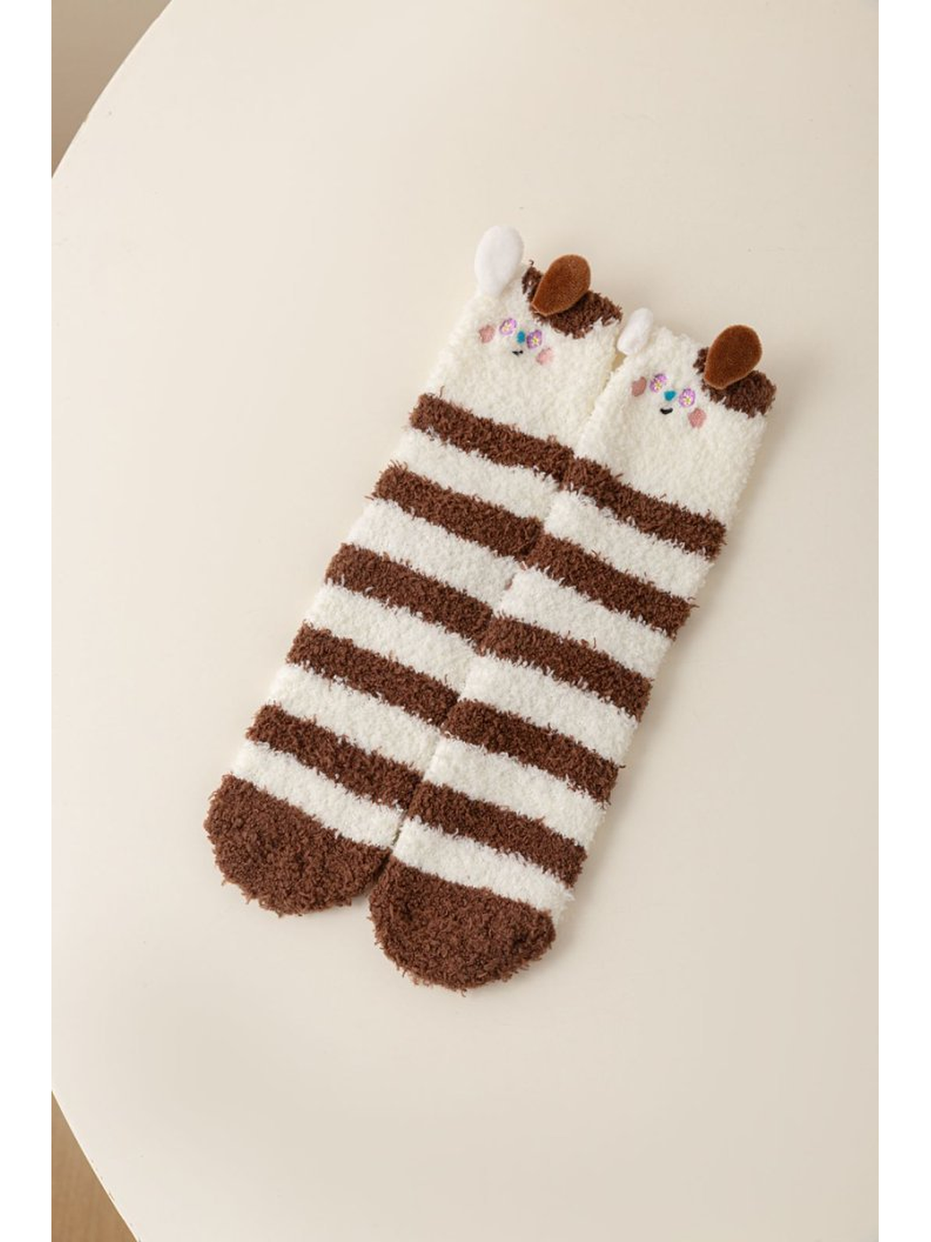 Brown and cream striped fuzzy animal character socks with raised ear accents