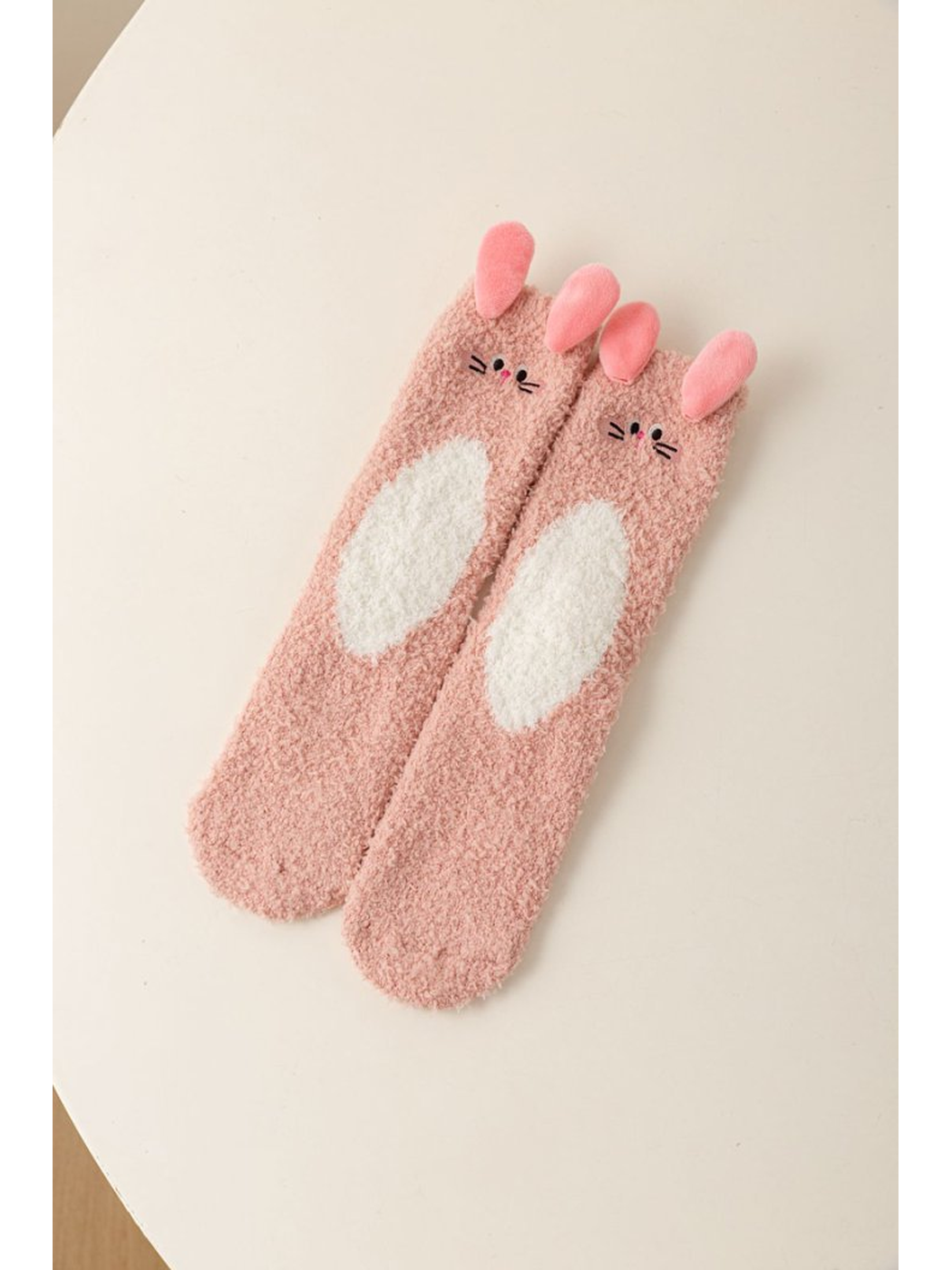 Dusty Pink fuzzy rabbit character socks with raised ears and a white belly motif