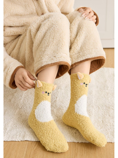 Yellow animal character crew socks worn with cream loungewear