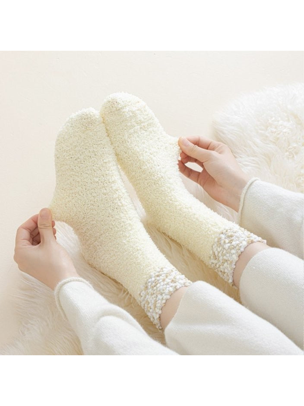 Cream Ivory fuzzy crew socks stretched while worn