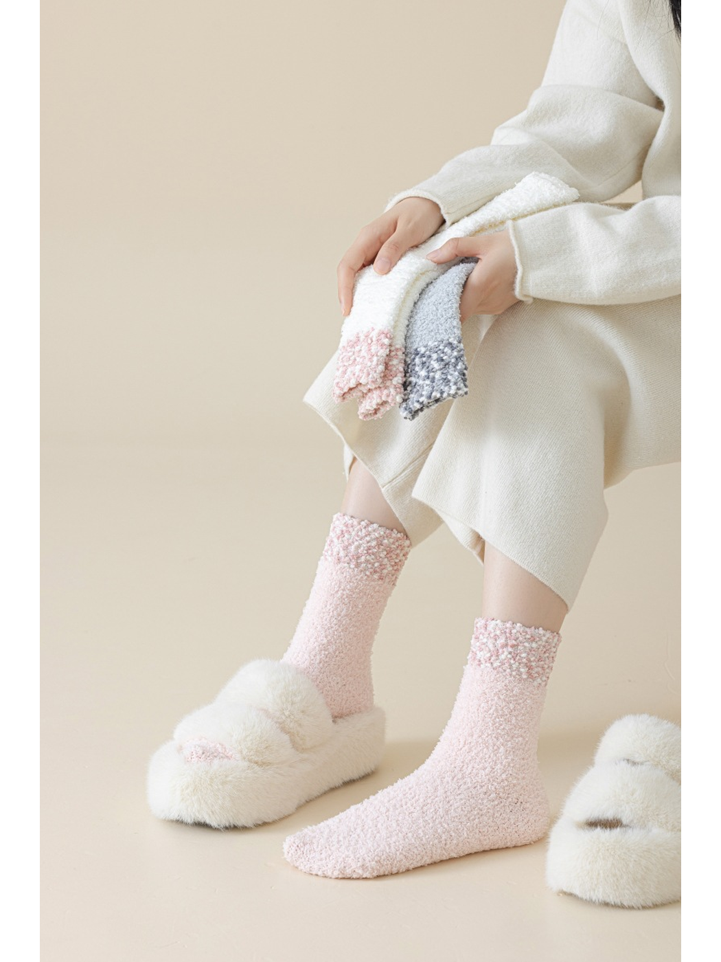 Light Pink fuzzy crew socks worn with cream pants