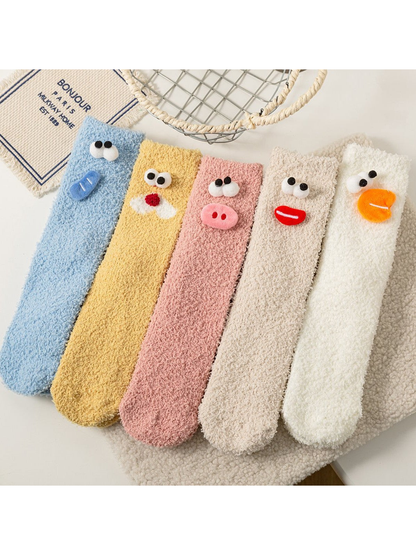 Five fuzzy cartoon face sock colors displayed together