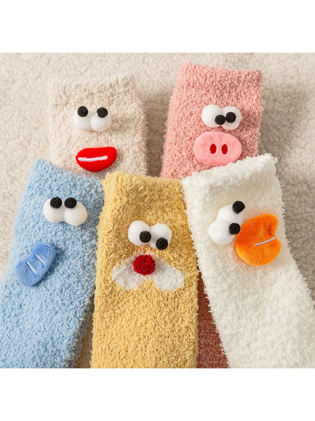 Close-up of fuzzy sock texture and raised cartoon face appliques