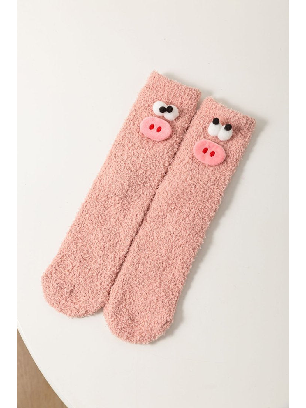 Dusty Pink fuzzy socks with raised pig face appliques