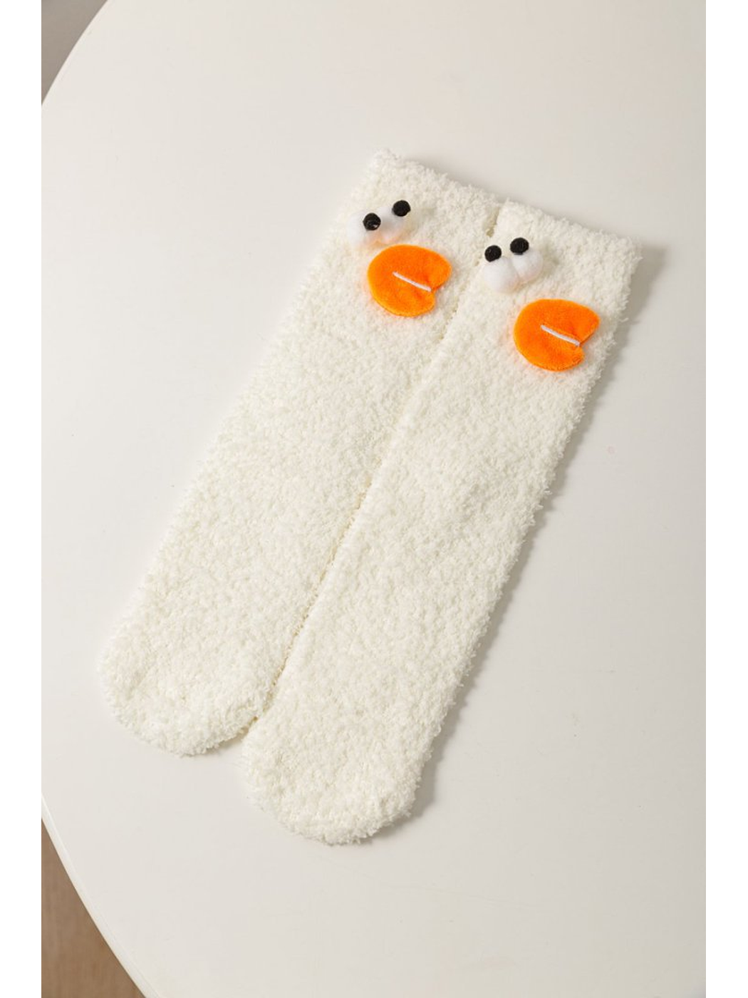 White fuzzy socks with raised duck face appliques