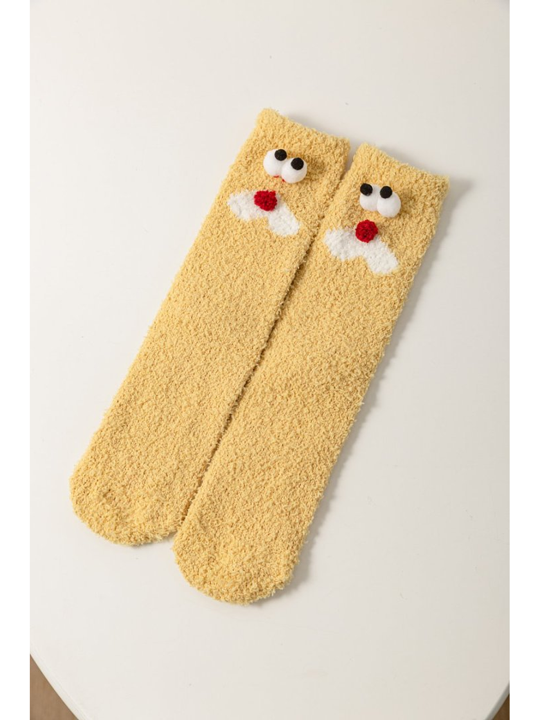 Mustard Yellow fuzzy socks with raised red-nosed face appliques