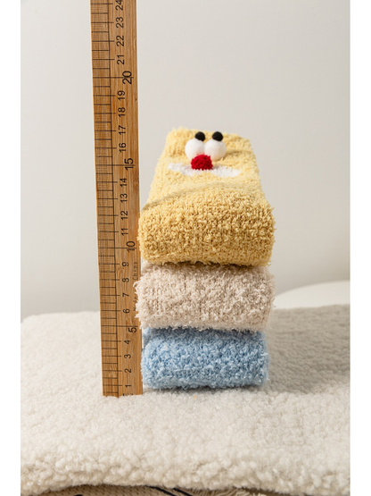 Sock stack beside a ruler showing the folded height